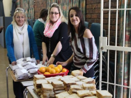 Andrea Vosloo (turqoise jersey), Claire Peters and Lindy Schutte of the Perdm Consulting, which donated some of sandwiches that were given to the homeless people at the Randburg Methodist Church.