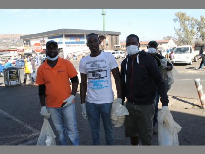 DJ Wildfire, Ambassadors 4 Change Founder Gathel Moyo and Junior Magare clean Beatrice Street in Windsor East on Mandela Day.