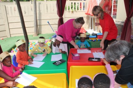 Eleanor Duston helping the children with the crafts along with teachers Kim Kohler and Sue Allen