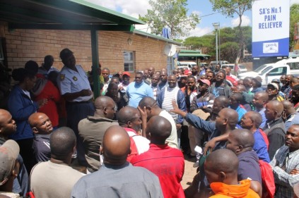 The Gauteng Department of Community Safety, Randburg Police and taxi drivers discuss their differences at the Randburg Taxi Rank on 17 October.