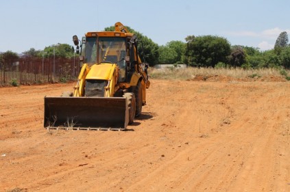 Department of Public works uses bulldozer to level land in Kensington B.