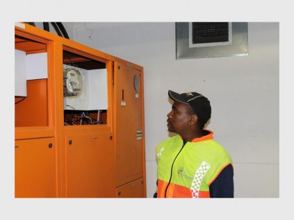 City employee indicates the meter that belongs to the municipality.