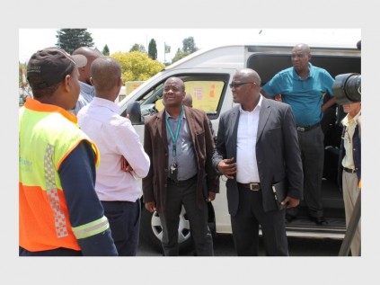 Johannes Morewa and Christopher Ntshingwa (with glasses) at the China Discount Shopping Centre.